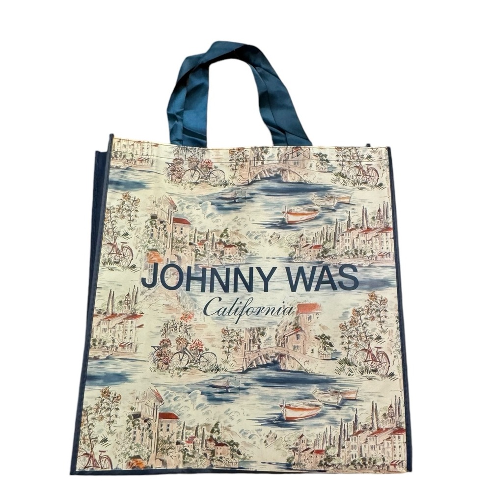 Johnny Was large vinyl European cityscape
shopping tote with ribbon handles.
NEW